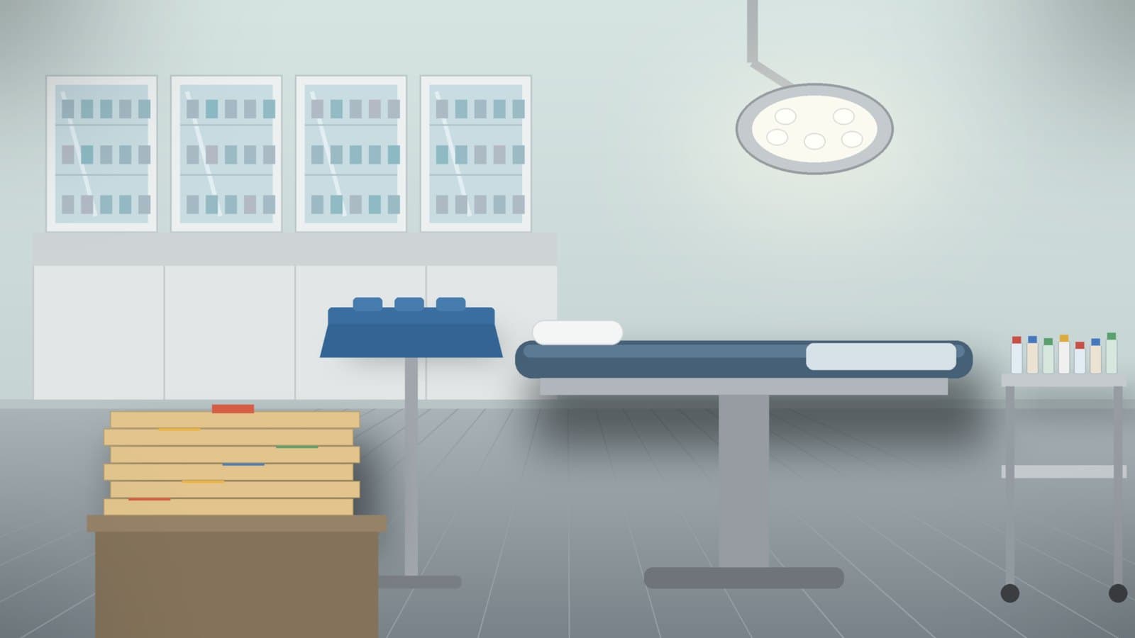 An empty ambulatory surgery center room with a covered instrument tray, unlabeled drug vials, and claim folders for a CMS ASC update